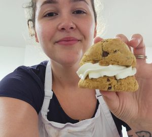 Bailey Knight holds a cream filled cookie